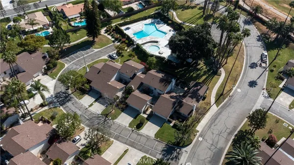 an aerial view of residential houses with outdoor space