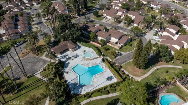 an aerial view of a house with a yard