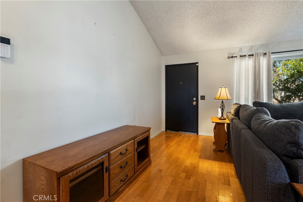 6624 Banyan Place Riverside, CA 92506 - Photo 7 of 41 a living room with a couch and a table
