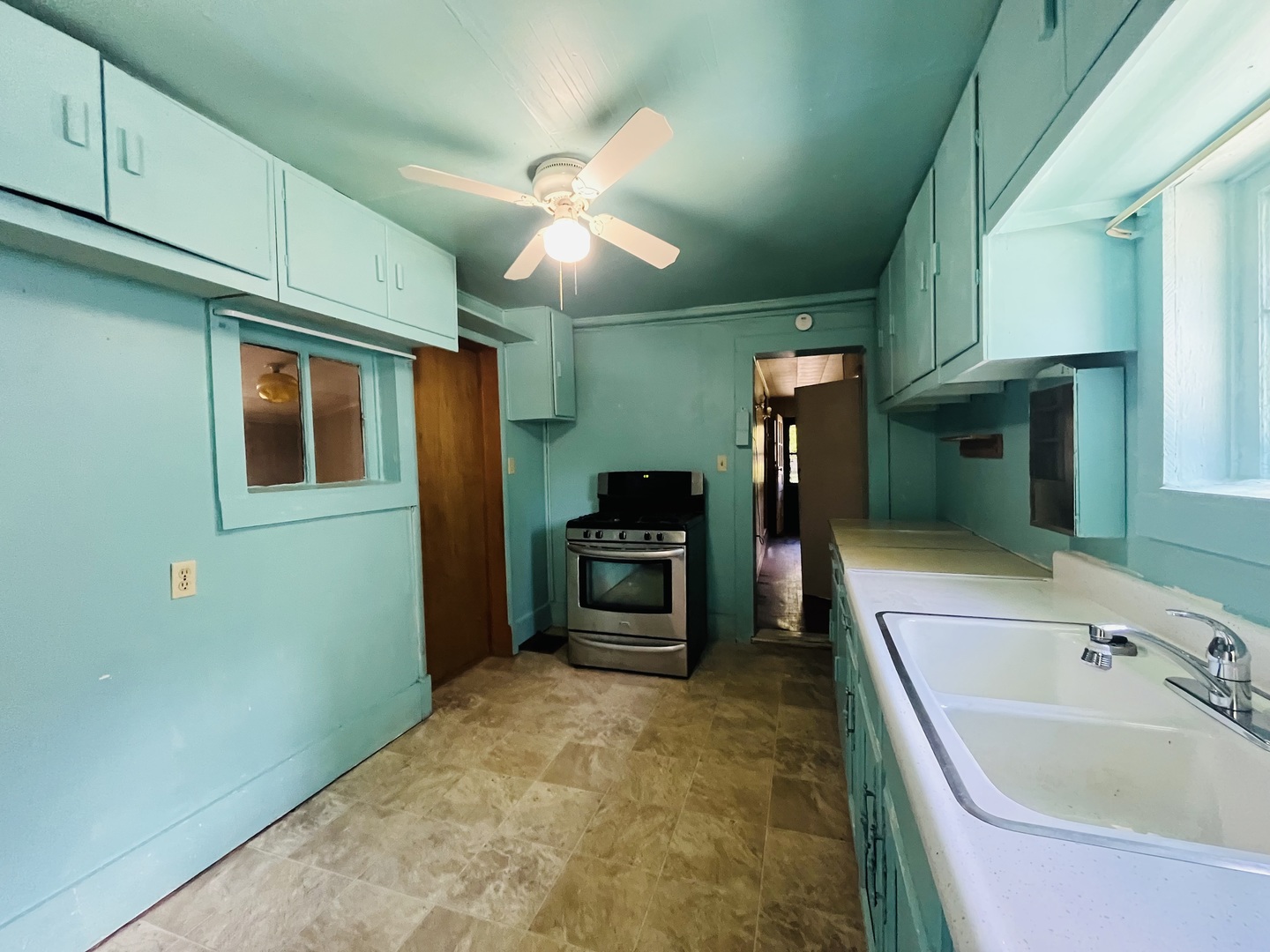 1213 East Main Street Streator, IL 61364 - Photo 14 of 18 a bathroom with a sink and a large mirror