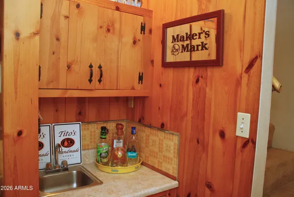 a kitchen with a sink and cabinets