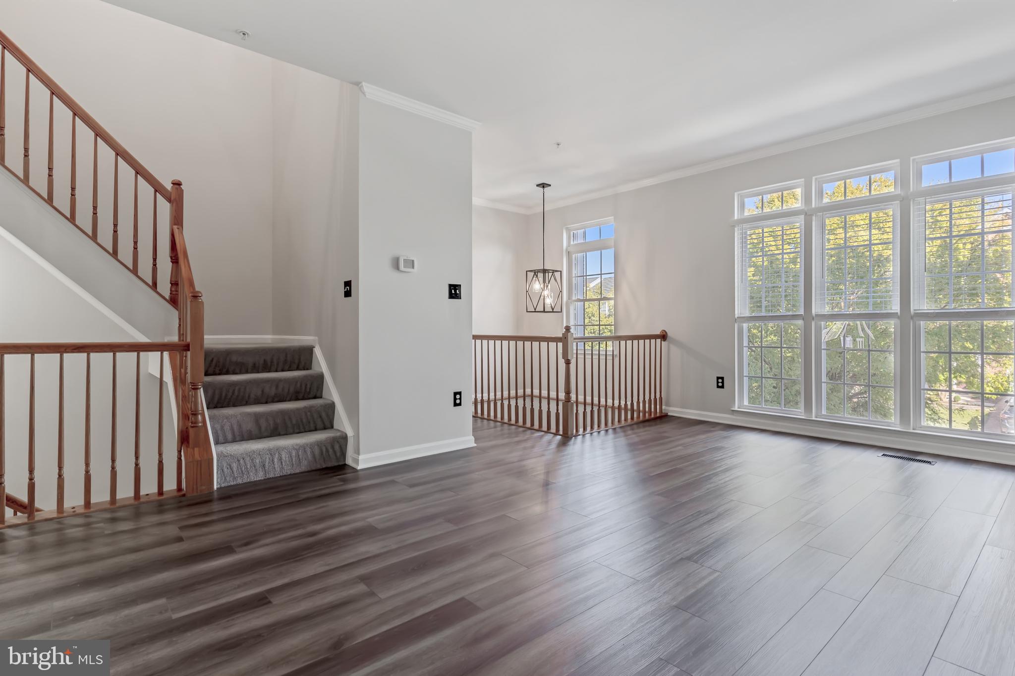 2432 Jostaberry Way Odenton, MD 21113 - Photo 22 of 42 wooden floor in an empty room with a window and wooden floor