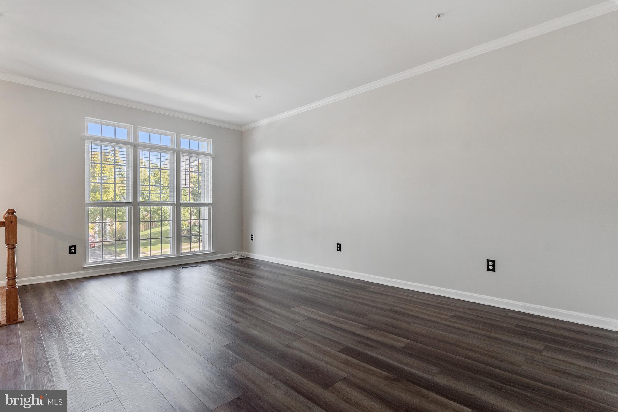 2432 Jostaberry Way Odenton, MD 21113 - Photo 23 of 42 a view of an empty room with wooden floor and a window