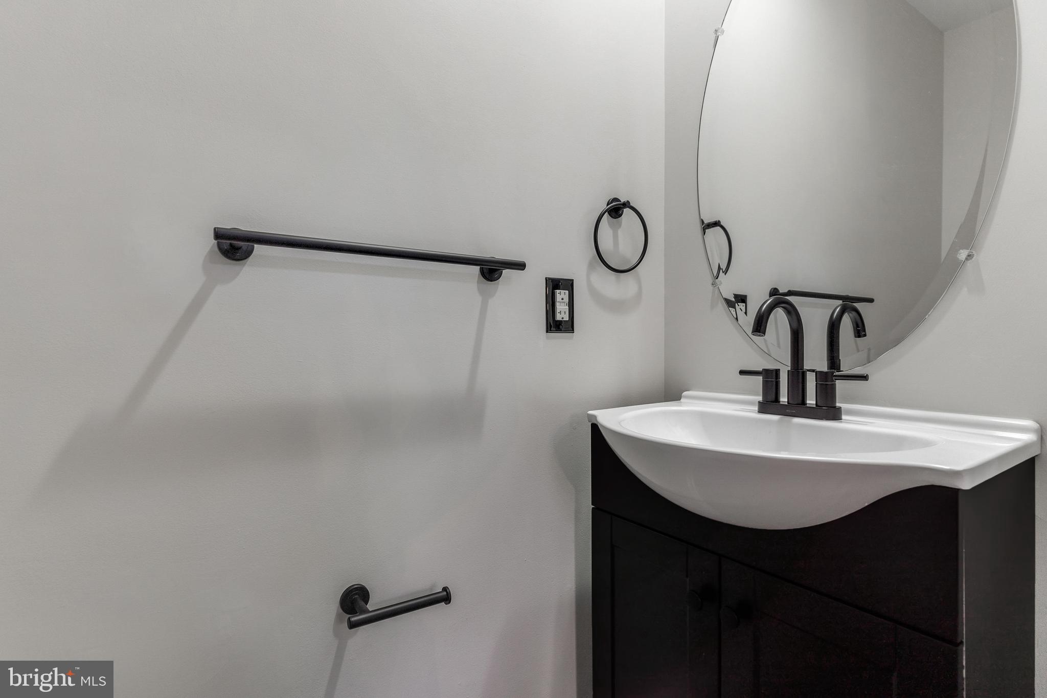 2432 Jostaberry Way Odenton, MD 21113 - Photo 24 of 42 a bathroom with a sink and mirror