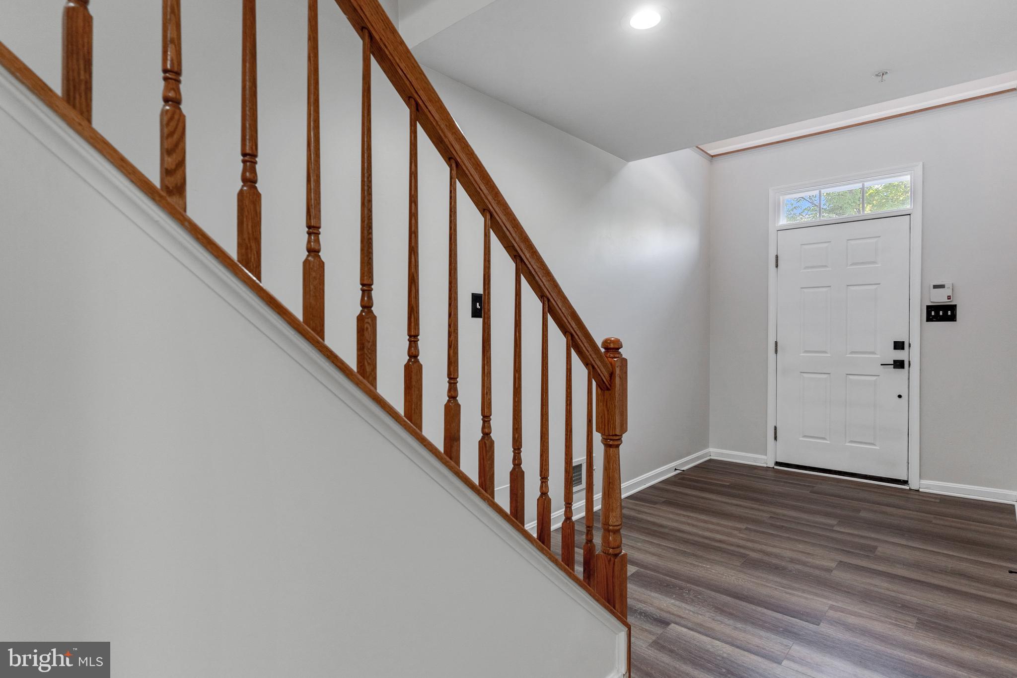 2432 Jostaberry Way Odenton, MD 21113 - Photo 5 of 42 a view of an entryway with wooden floor