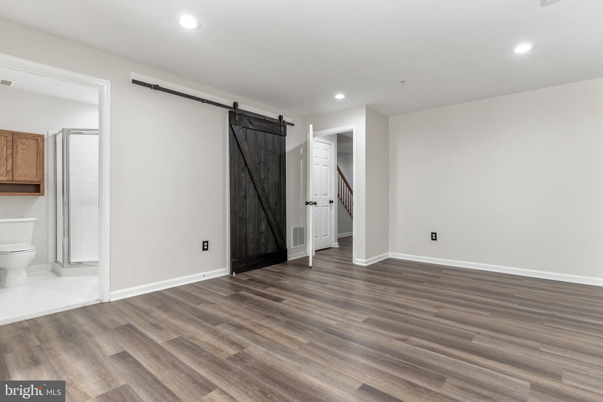 2432 Jostaberry Way Odenton, MD 21113 - Photo 6 of 42 a view of a livingroom with wooden floor