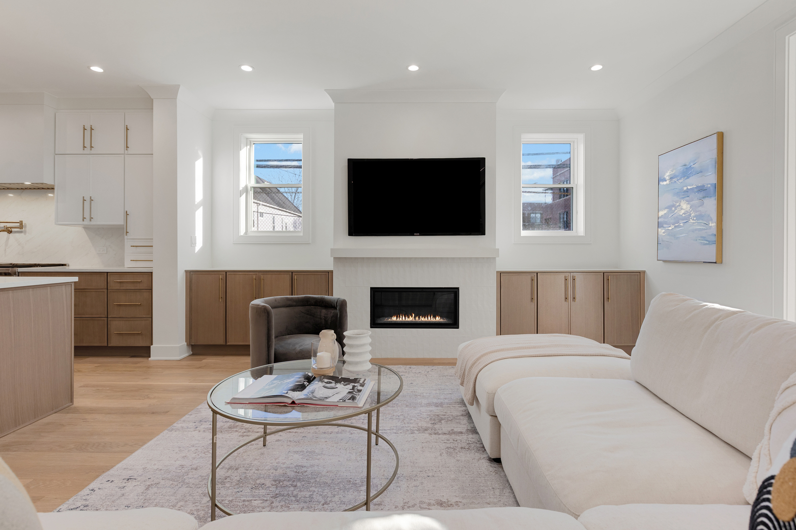 3614 North Marshfield Avenue Chicago, IL 60613 - Photo 19 of 61 a living room with furniture a fireplace and a flat screen tv
