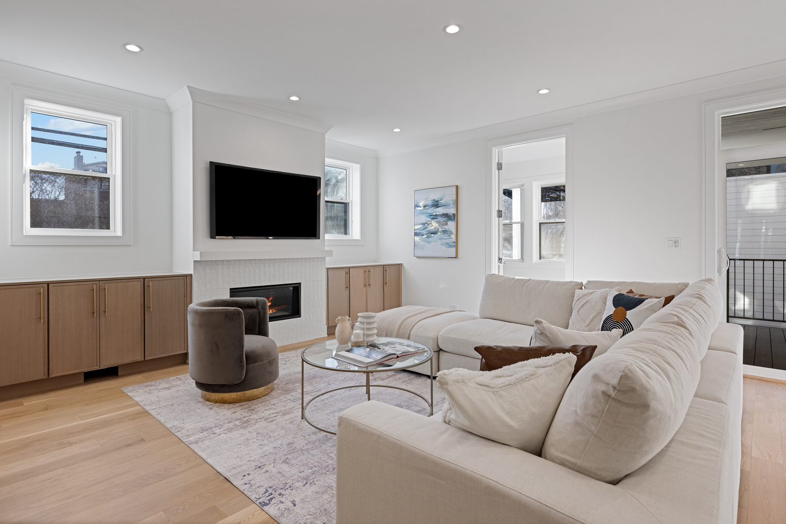 3614 North Marshfield Avenue Chicago, IL 60613 - Photo 20 of 61 a living room with furniture a flat screen tv and a fireplace