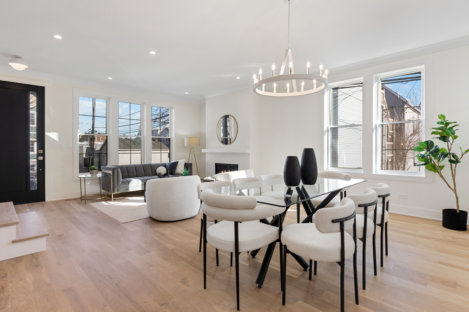 3614 North Marshfield Avenue Chicago, IL 60613 - Photo 2 of 61 a living room with fireplace furniture and a chandelier