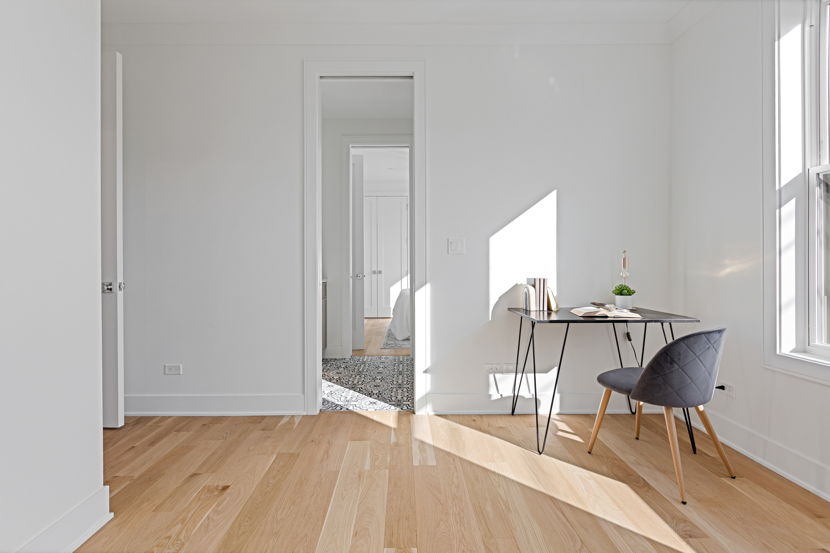 3614 North Marshfield Avenue Chicago, IL 60613 - Photo 36 of 61 a view of an empty room with a window and wooden floor