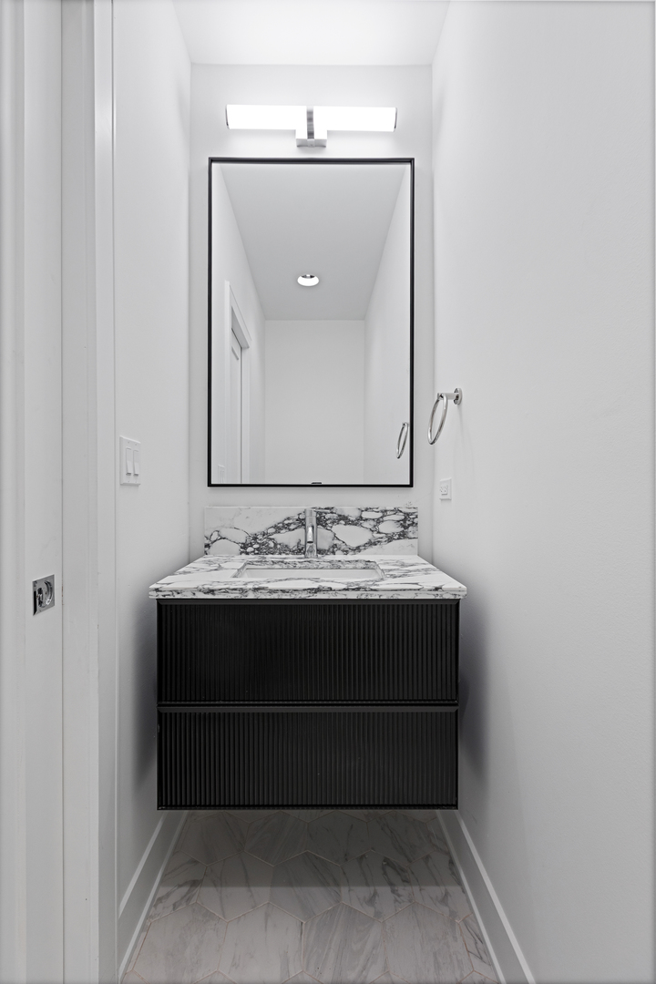 3614 North Marshfield Avenue Chicago, IL 60613 - Photo 44 of 61 a view of room with a sink and mirror