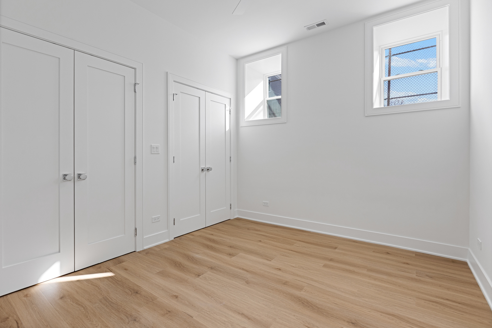 3614 North Marshfield Avenue Chicago, IL 60613 - Photo 45 of 61 a view of an empty room with wooden floor