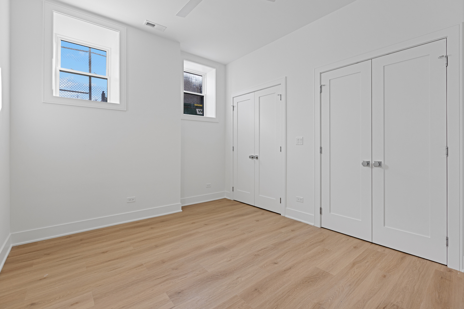 3614 North Marshfield Avenue Chicago, IL 60613 - Photo 48 of 61 a view of an empty room with wooden floor