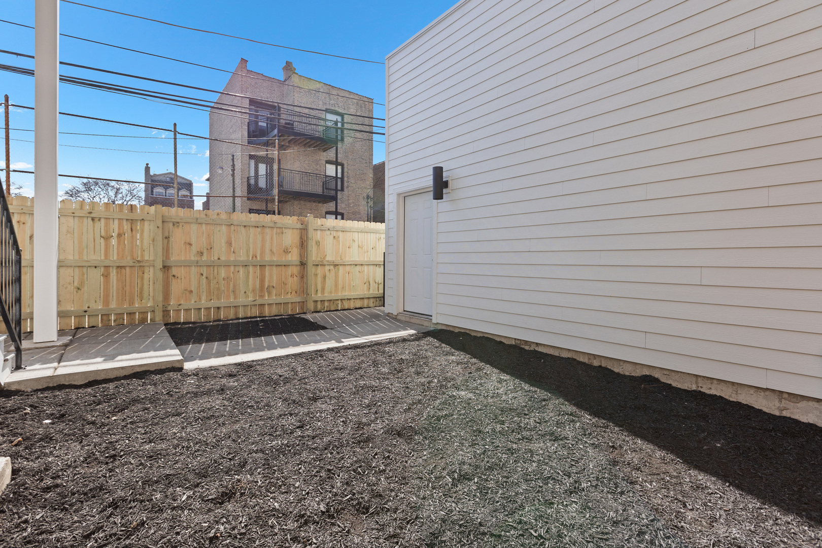 3614 North Marshfield Avenue Chicago, IL 60613 - Photo 55 of 61 a view of a house with a backyard