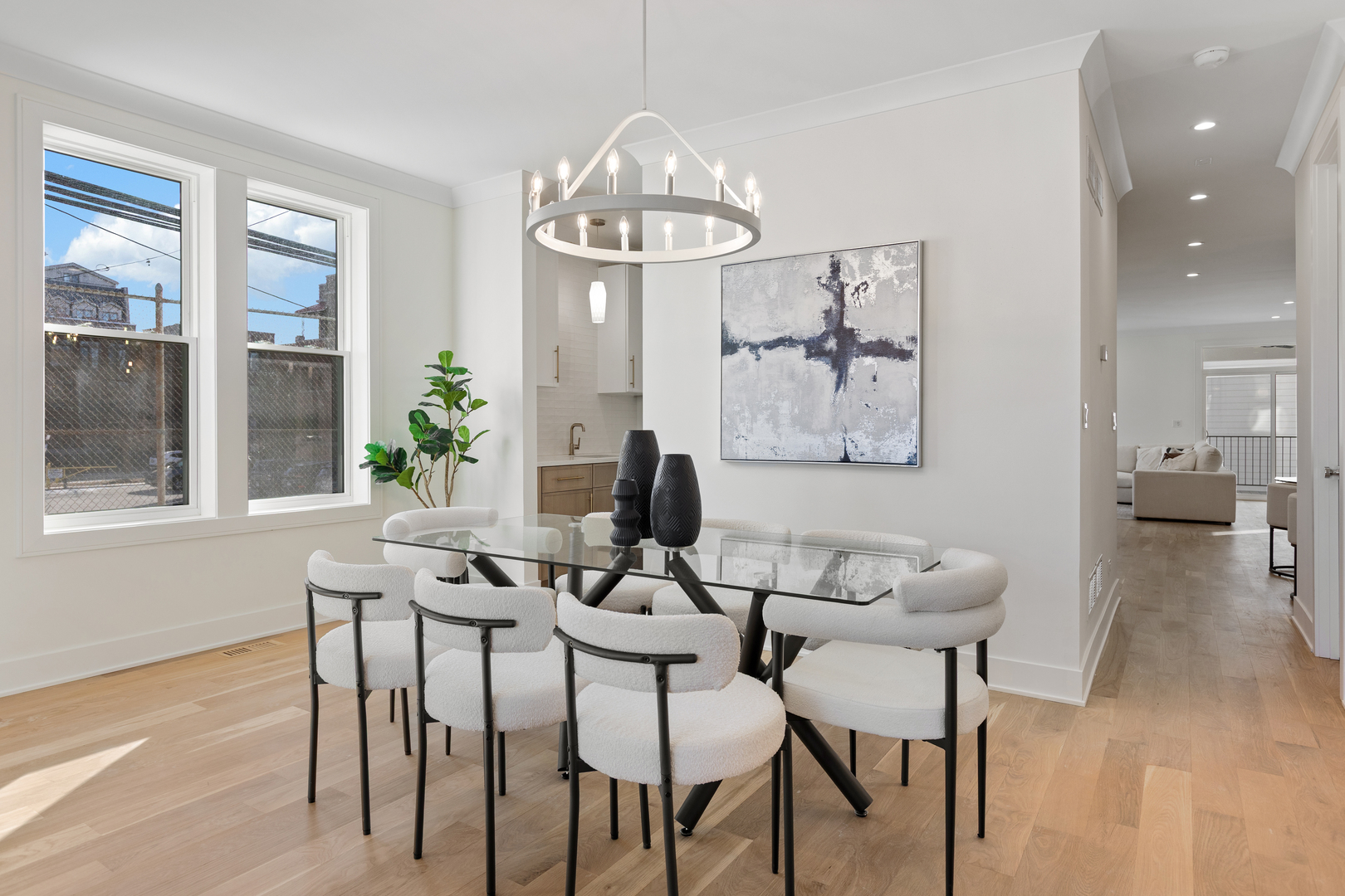 3614 North Marshfield Avenue Chicago, IL 60613 - Photo 7 of 61 a view of a dining room with furniture a chandelier and wooden floor