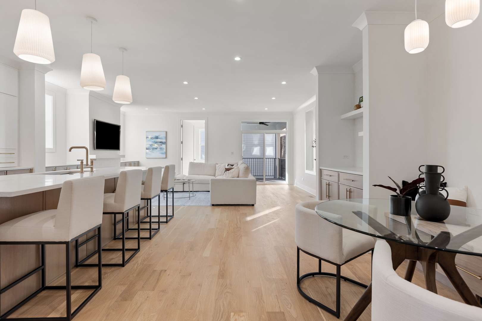 3614 North Marshfield Avenue Chicago, IL 60613 - Photo 10 of 61 a living room with furniture kitchen view and a wooden floor
