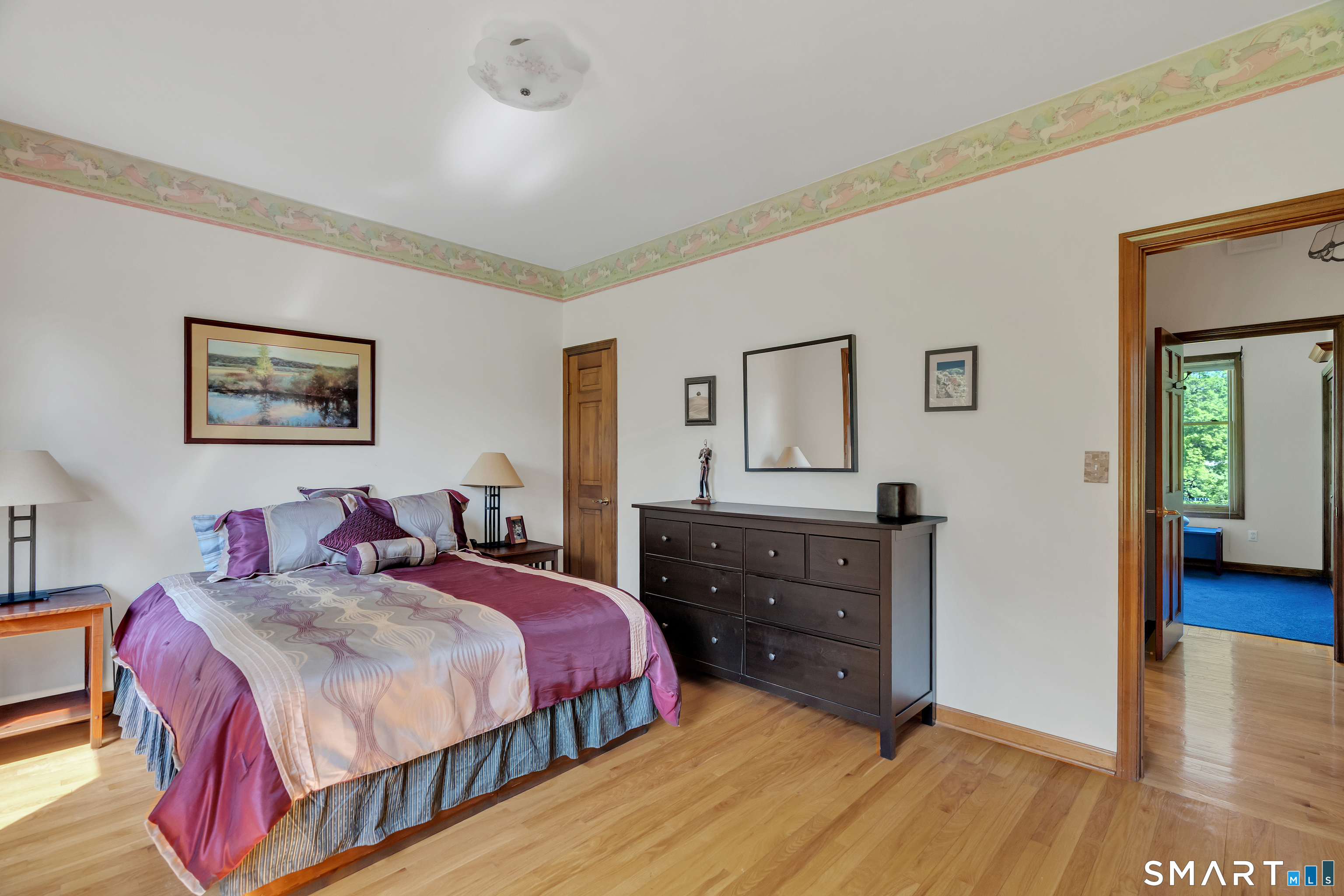 194 Quaker Farms Road Oxford, CT 06478 - Photo 24 of 40 a bedroom with a bed and a table