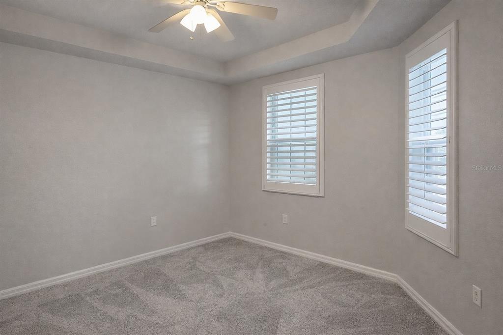 5123 Melbourne Street, Unit D203 Punta Gorda, FL 33980 - Photo 11 of 16 an empty room with a window