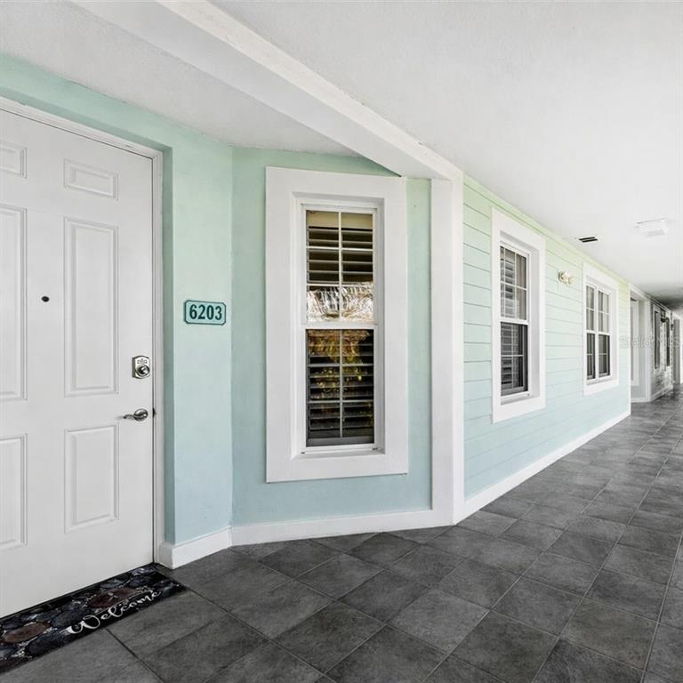 5123 Melbourne Street, Unit D203 Punta Gorda, FL 33980 - Photo 6 of 16 a view of an empty room with windows