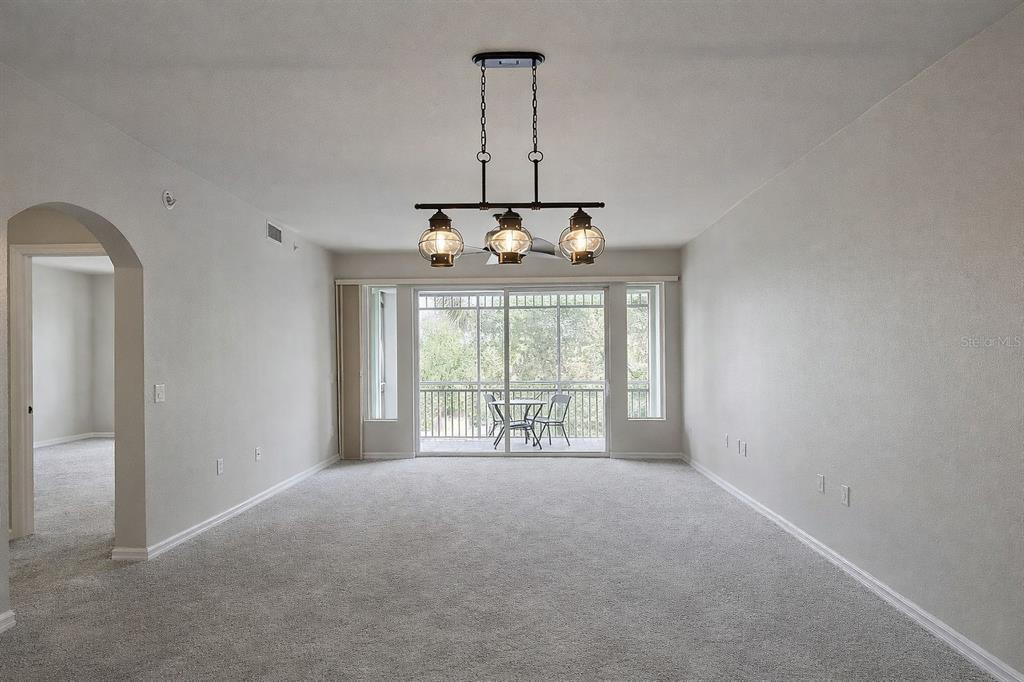 5123 Melbourne Street, Unit D203 Punta Gorda, FL 33980 - Photo 9 of 16 a view of an empty room with a window