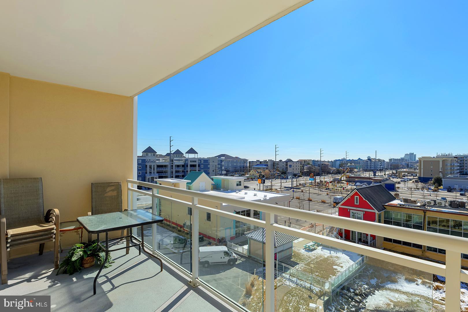 4601 Coastal Highway, Unit 403 Ocean City, MD 21842 - Photo 19 of 56 a view of a balcony with chairs