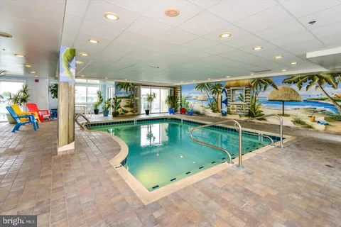 a view of a swimming pool with an ocean view