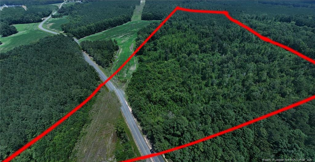 a view of a yard with a swimming pool