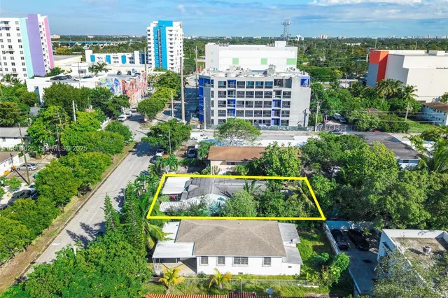 a view of a cars park in front of house