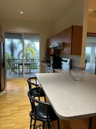 a kitchen with stainless steel appliances granite countertop a refrigerator sink and cabinets