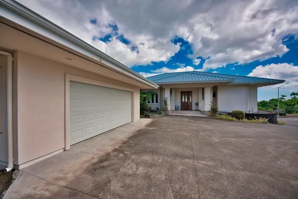 a view of a house with a garage