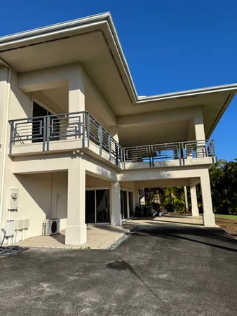 a view of a car park in front of house
