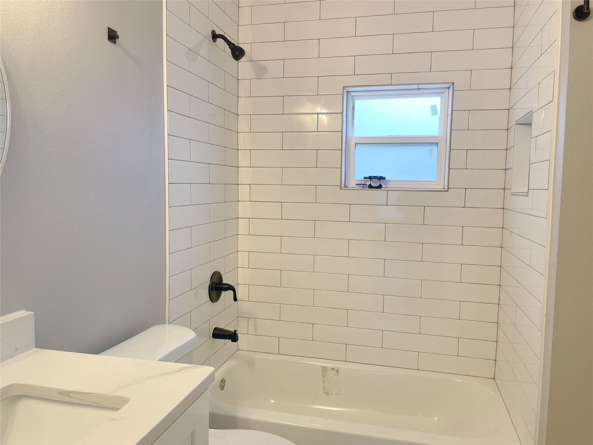 2609 3rd Street Rosenberg, TX 77471 - Photo 9 of 12 NEW glass tile backsplash and matte black shower fixtures
