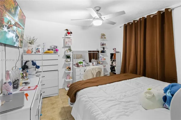 a bed room with a bed and a window