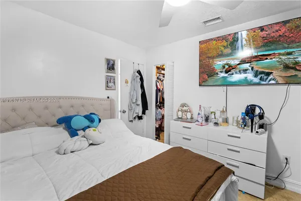 a bathroom with a sink mirror and vanity