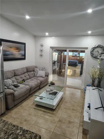 a living room with furniture and a table