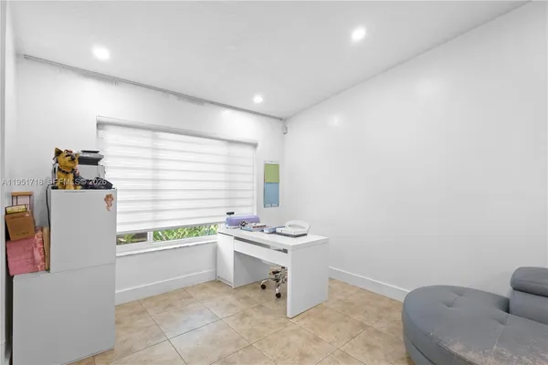 a room with furniture a washer and dryer