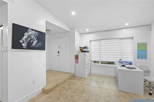 a room with furniture and white walls