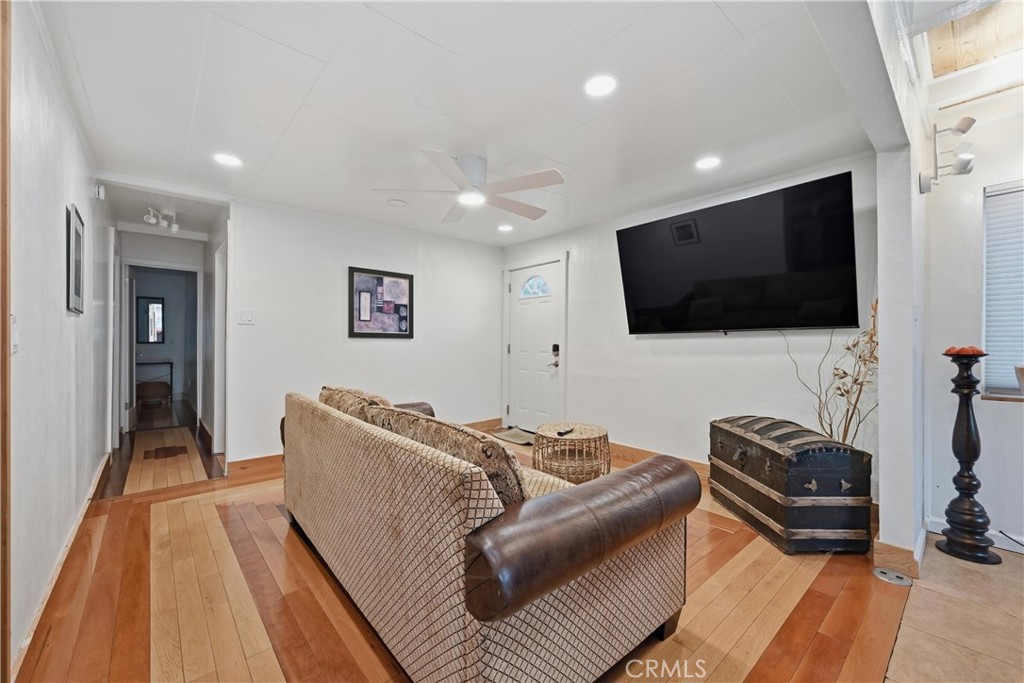 6025 Front Street Clearlake, CA 95422 - Photo 16 of 32 a living room with furniture and a flat screen tv