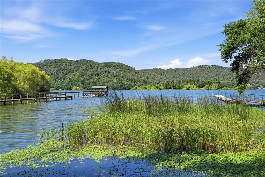 6025 Front Street Clearlake, CA 95422 - Photo 32 of 32 a view of a lake with a mountain in the background