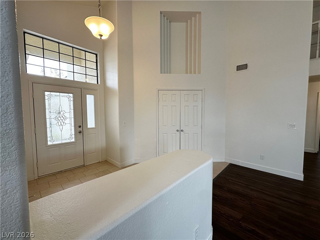 2113 Rico Peak Court Las Vegas, NV 89128 - Photo 14 of 53 Entryway with a high ceiling and dark wood-type flooring