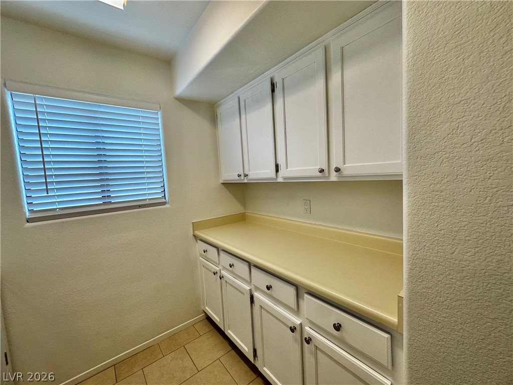 2113 Rico Peak Court Las Vegas, NV 89128 - Photo 18 of 53 Laundry room with a textured wall and light tile patterned flooring