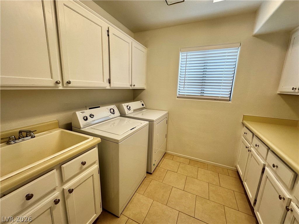 2113 Rico Peak Court Las Vegas, NV 89128 - Photo 19 of 53 Laundry room with cabinet space, separate washer and dryer, and light tile patterned flooring