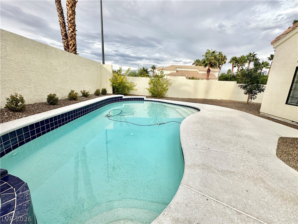 2113 Rico Peak Court Las Vegas, NV 89128 - Photo 3 of 53 View of swimming pool with a fenced backyard and patio surround