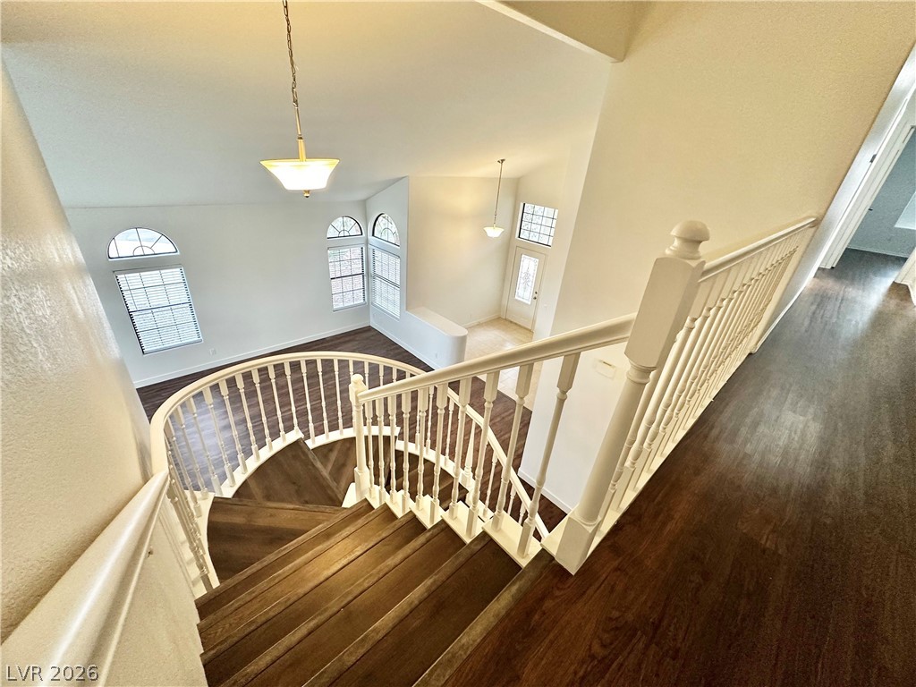 2113 Rico Peak Court Las Vegas, NV 89128 - Photo 43 of 53 Stairway featuring wood finished floors and a high ceiling