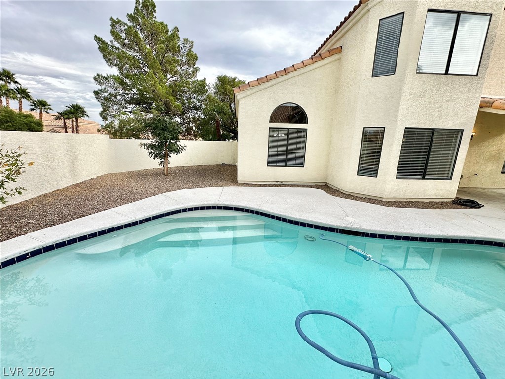 2113 Rico Peak Court Las Vegas, NV 89128 - Photo 47 of 53 View of pool featuring patio surround and a fenced backyard