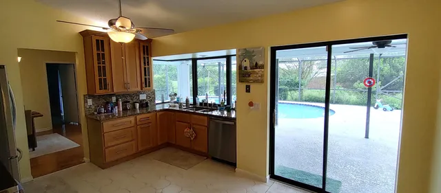 a view of a table and chairs in the garden
