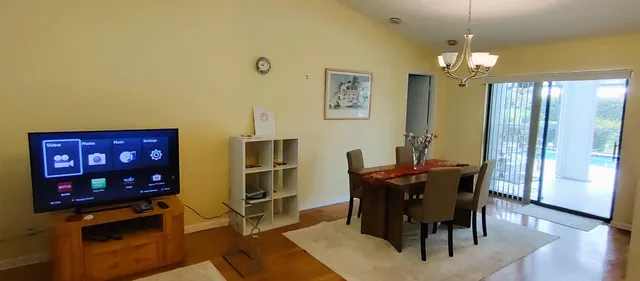 a bed room with a bed and a chandelier