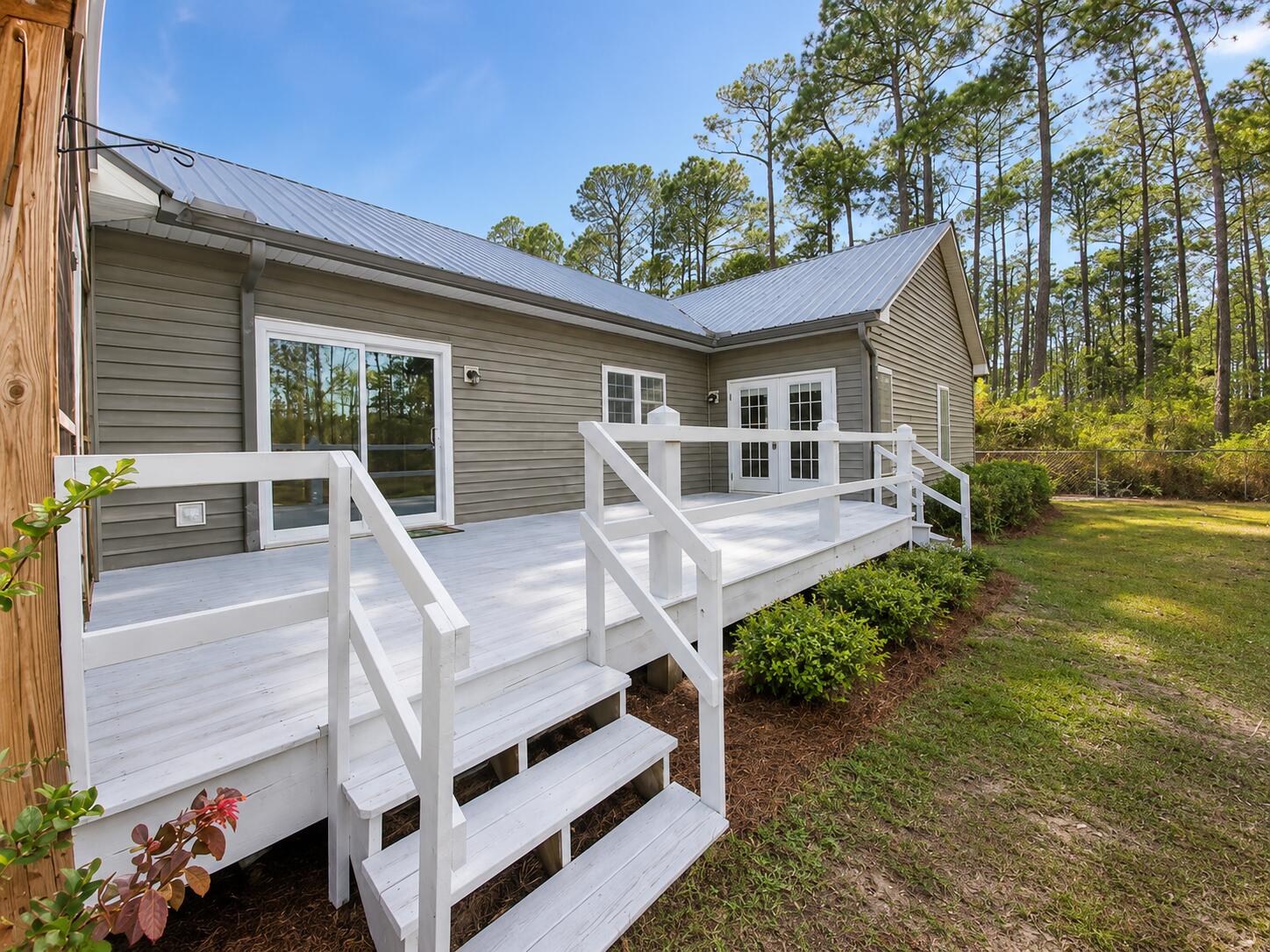 147 Dover Lane Freeport, FL 32439 - Photo 23 of 27 a view of a house with backyard and porch