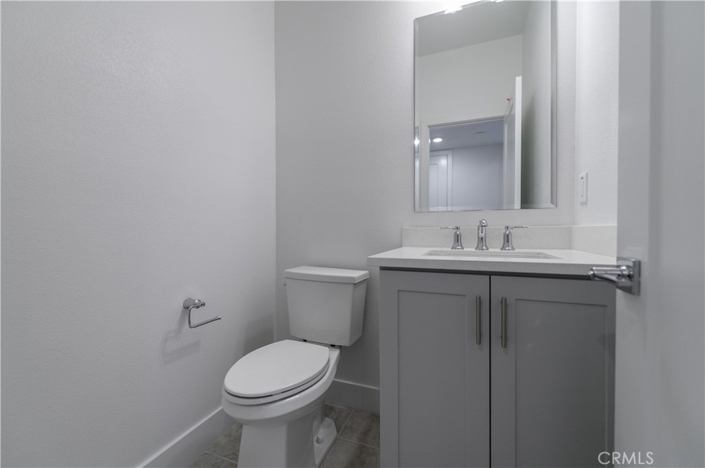 194 Abacus Irvine, CA 92618 - Photo 14 of 34 a bathroom with a sink toilet and a mirror