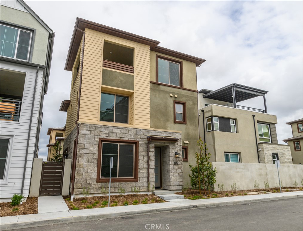 194 Abacus Irvine, CA 92618 - Photo 2 of 34 a front view of a house with garage and windows